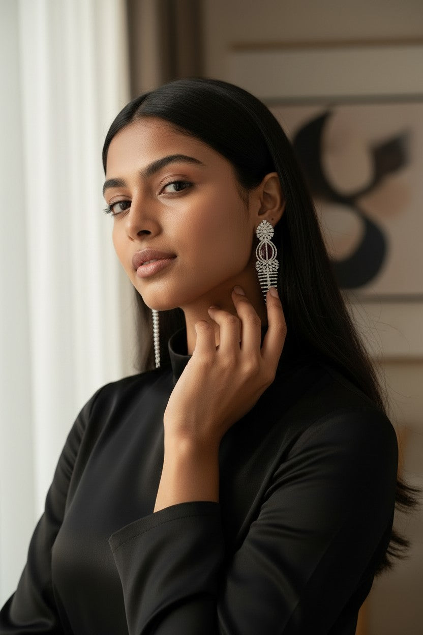 Elegant Rhodium-Plated Cascading Chandelier Earrings with Ruby-Red Centerpiece.