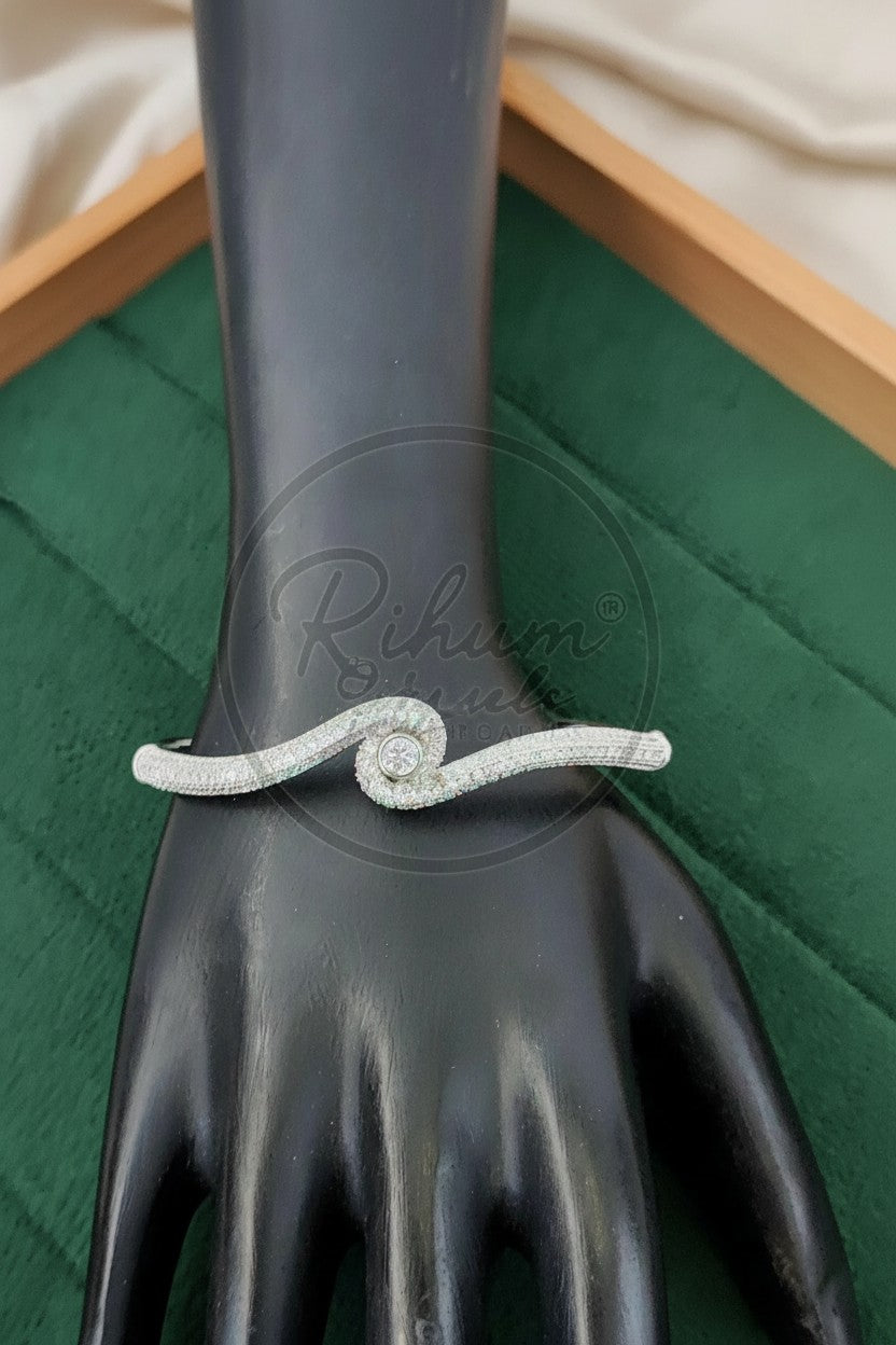 Elegant Serpentine Solitaire Wave Kada Bracelet.