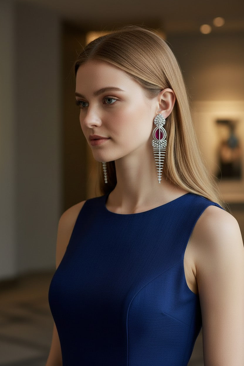 Elegant Rhodium-Plated Cascading Chandelier Earrings with Ruby-Red Centerpiece.