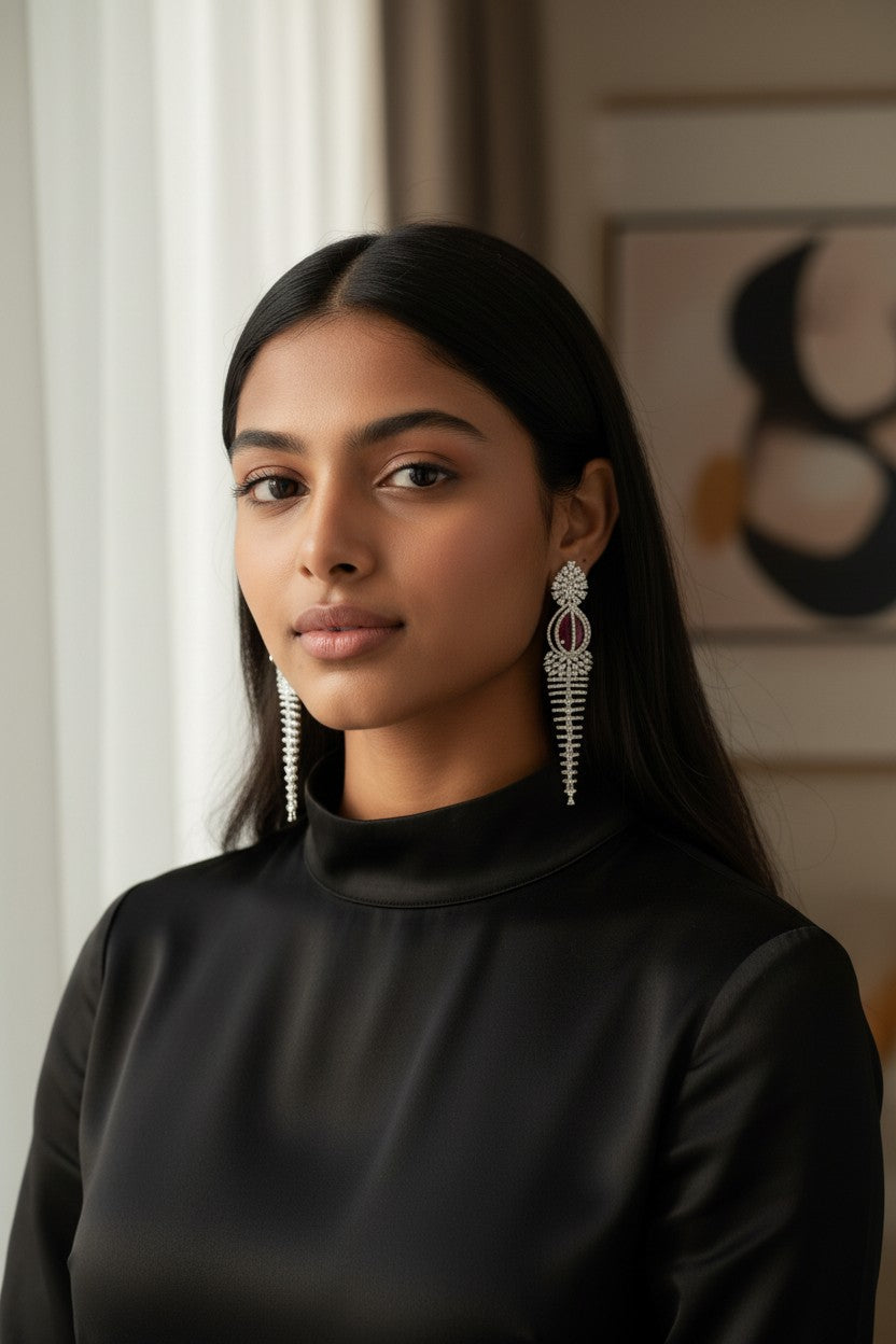 Elegant Rhodium-Plated Cascading Chandelier Earrings with Ruby-Red Centerpiece.