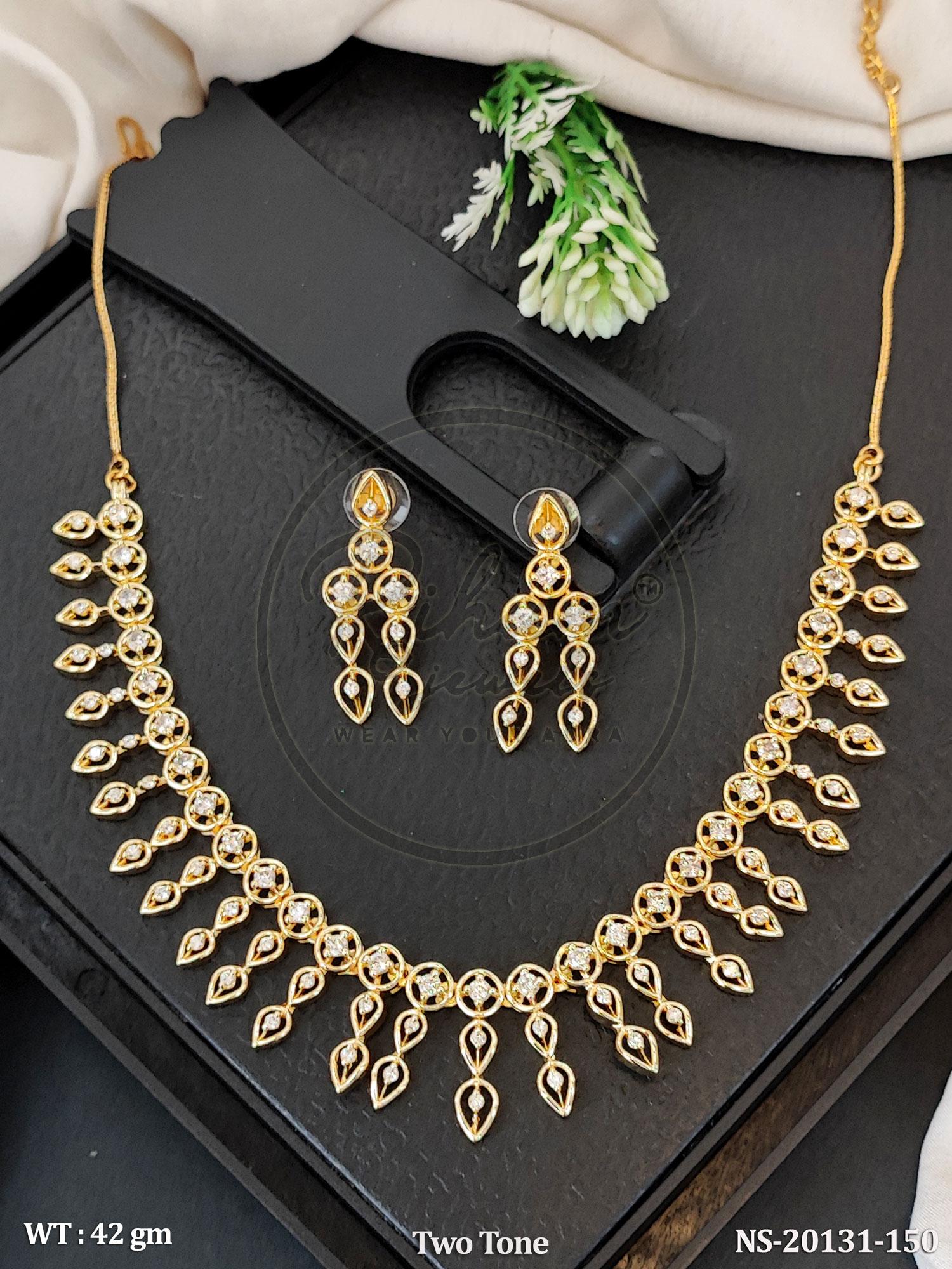 Two-Tone Gold Plated Choker Necklace Set with American Diamond Dangling Earrings.