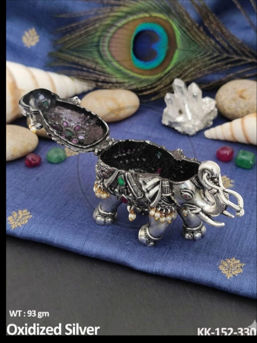 Rihum Jewels handcrafted oxidized silver elephant figurine with ruby and emerald inlays and dangling pearl accents.