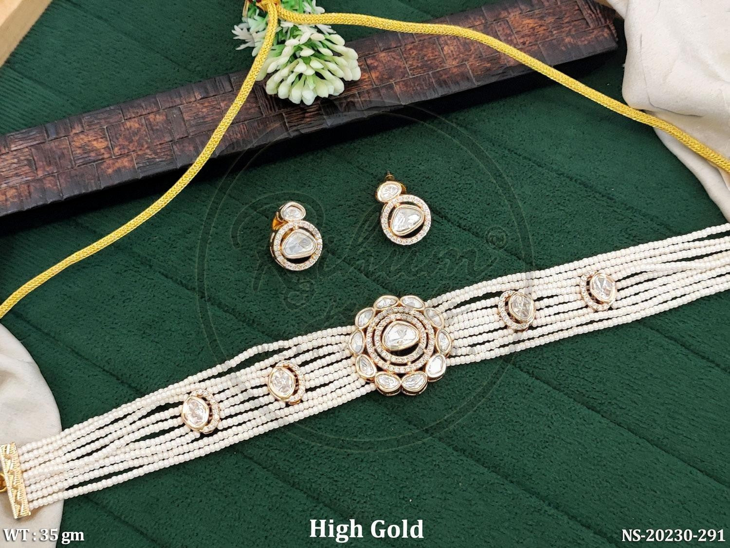 Rihum Jewels multi-strand white pearl choker necklace set with a gold-tone floral pendant and matching stud earrings.